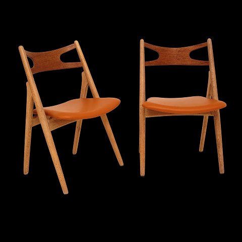 Hans J. Wegner, Denmark: Set of four "Sawhorse 
Chairs", CH29, by Carl Hansen & Søn, Denmark, with 
new upholstery