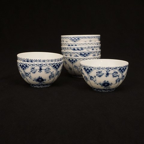 A set of nine Royal Copenhagen blue fluted full 
lace small bowls. #1142-4. H: 6,3cm