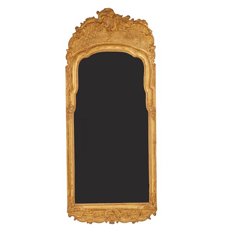 A gilt wood cut Rococo mirror. Sweden circa 1770. 
Measures: 125x53cm