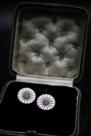 A pair of old Marguerit / Daisy earrings with clips in sterling silver and white 
enamel from A. Michaelsen...