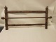 Hanging-tool for the tea towel
An old hanging-tool for the tea towel. It is made 
of wood incl. 3 hooks.
Place the tea towel over the front bar and other 
tools for the kitchen on the 3 hooks.
W: 74cm, H: 40cm