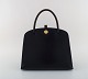 L'Art presents: 
Vintage 
Hermès handbag 
in black 
leather. 1960 / 
70's.
