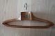 Coat hanger made of wood - old
Decorative and good in use
Text: Christian Thomsen Barnevogne, Børste & 
Kurvevarer - Trævarer og Maatter
