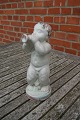 Michael Andersen Danish pottery, Bornholm. Naked 
boy with trumpet, and a chip on the low plinth