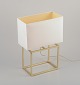 Designer 
bordlampe i 
messing med 
hvid skærm i 
stof. ...