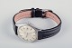 Omega Geneve 
ladies' 
wristwatch with 
a black leather 
strap.