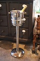 K&Co. presents: 
Old stand 
in chromed 
metal with 
champagne 
cooler/bucket 
at the top...