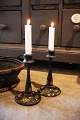 K&Co. presents: 
A pair of 
old Swedish 
wooden 
candlesticks 
painted with 
floral 
motifs...