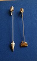 Georg Jensen Denmark Christmas decorations. Pair 
of candle holders in gilded brass, Pair of candle 

holders in gilt brass, Krämmerhus and Swan