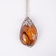 Osted Antik & Design presents: Pendant with silver necklace in silver and amber, unique design