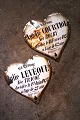 K&Co. presents: 
Decorative, 
old French 
memorial hearts 
in iron and 
enamel with 
writing and 
patina dating 
back ...