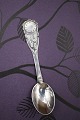 K&Co. presents: Children's spoon in silver (stamped) with a clock face motif...