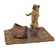 Aabenraa Antikvitetshandel presents: Large Vienna bronze with dog with a bag on a carpet. Marked. H: 12cm. ...