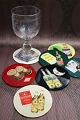 K&Co. presents: 7 old drinks glass trays with motifs of various spirits and liqueur brands...