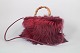 L'Art presents: Gucci bamboo handle leather and fur handbag.