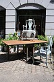 K&Co. presents: Antique 19th century Swedish folding table with base in blue patinated color and top in raw wood...