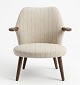 Lundin Antique presents: Beautiful armchair by Kurt Olsen with well-shaped teak armrests. Produced by Glostrup ...