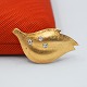 Ole Lynggaard; Brooch of 14k gold set with diamonds