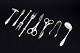 L'Art presents: Collection of eight silver-plated serving utensils.
