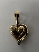 Antik Huset presents: 14 carat gold. Heart with inlaid diamond.Charms / Pendants.Height 1.8 cm.