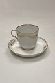Danam Antik presents: Royal Copenhagen No. 118/2005 Coffee Cup with Saucer Golden Peacock Ornament