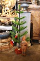 K&Co. presents: Christmas tree made of colored goose feathers mounted on an antique stand with red velvet fabric...
