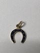 Antik Huset presents: 14 karat gold. Horseshoe with Blue enamel.Charms / Pendants.Height 1.4 cm.