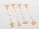 L'Art presents: Andreas Mikkelsen for Georg Jensen, set of four Golden Christmas candleholders.