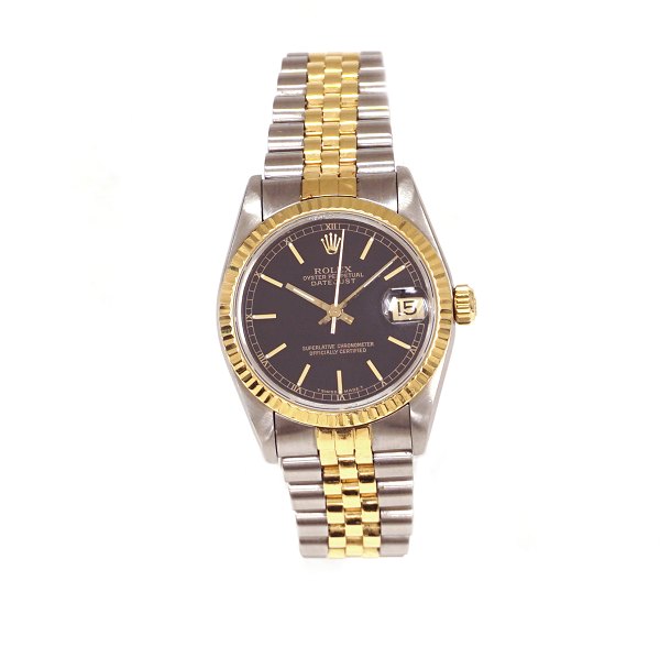 Rolex Oyster Perpetual Datejust, guld/stål, Solgt 10.04.1991. Leveres med 
original købsfaktura, certifikat, yder- og inderboks mv. Ref. 68273. D: 31mm. 
Pæn stand med små brugsspor