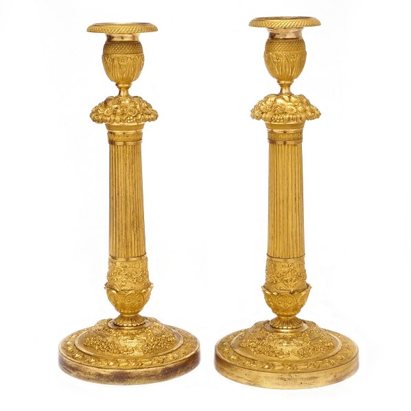 Pair of fire gilt Empire bronze candlesticks. France circa 1820. H: 34cm