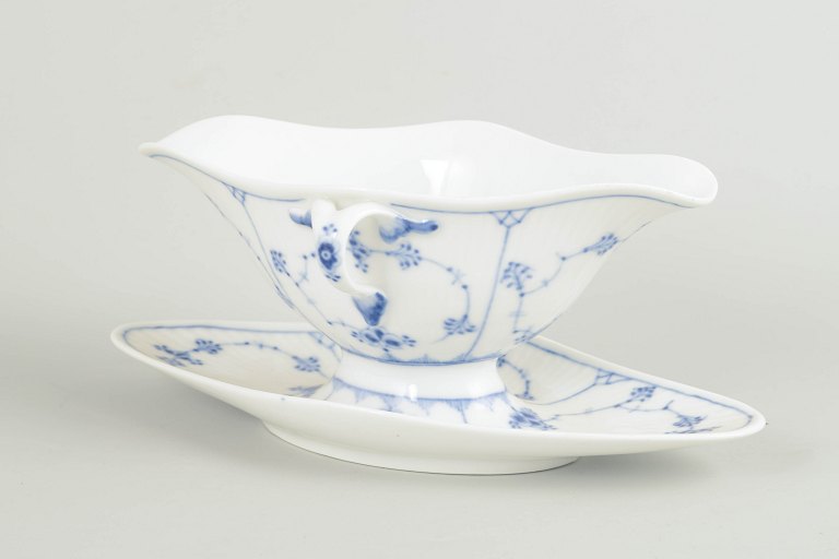 Royal Copenhagen Blue Fluted Plain sauce boat with attached stand.